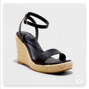 New, never worn, black wedge size 8.5W